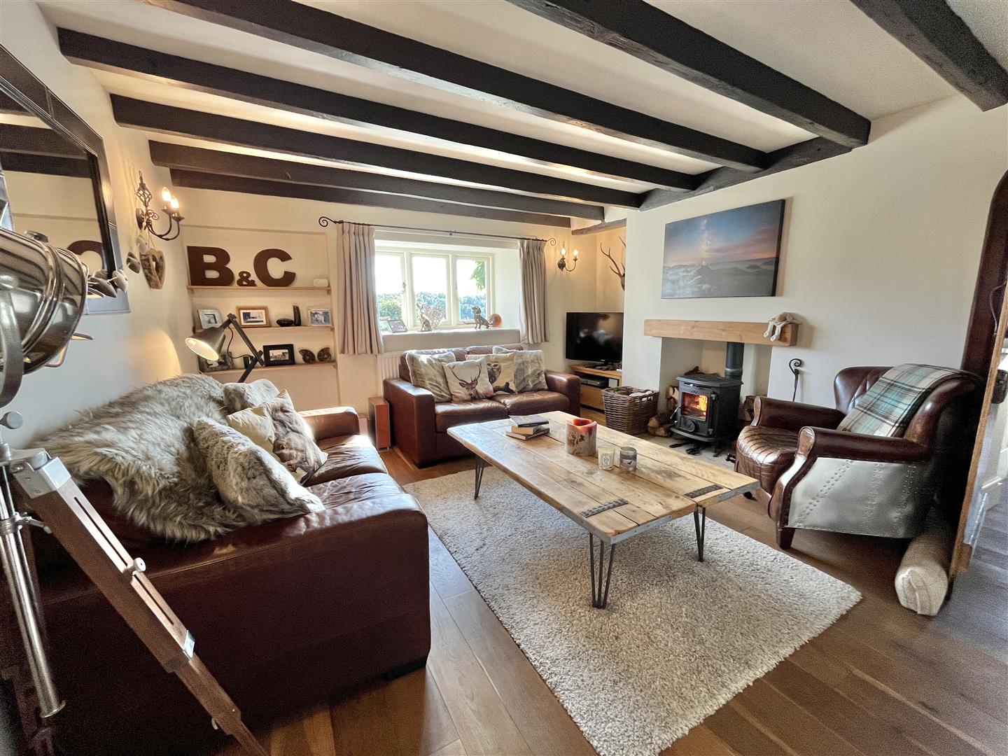 The snug with exposed beams and an AGA wood-burning stove