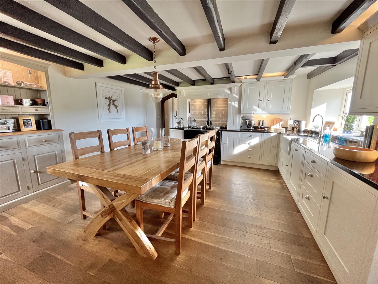 Dark-painted ceiling beams above the kitchen-diner